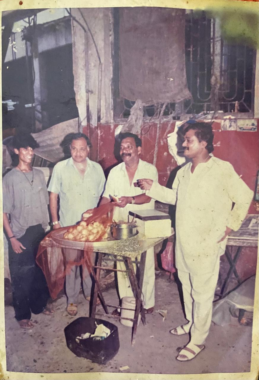 Archival street-side stall scene from the Ashok Vaidya family collection
