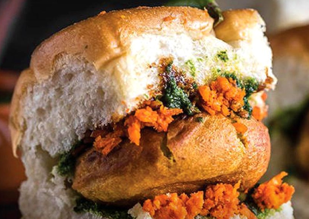Close-up of vada pav with green and garlic chutney